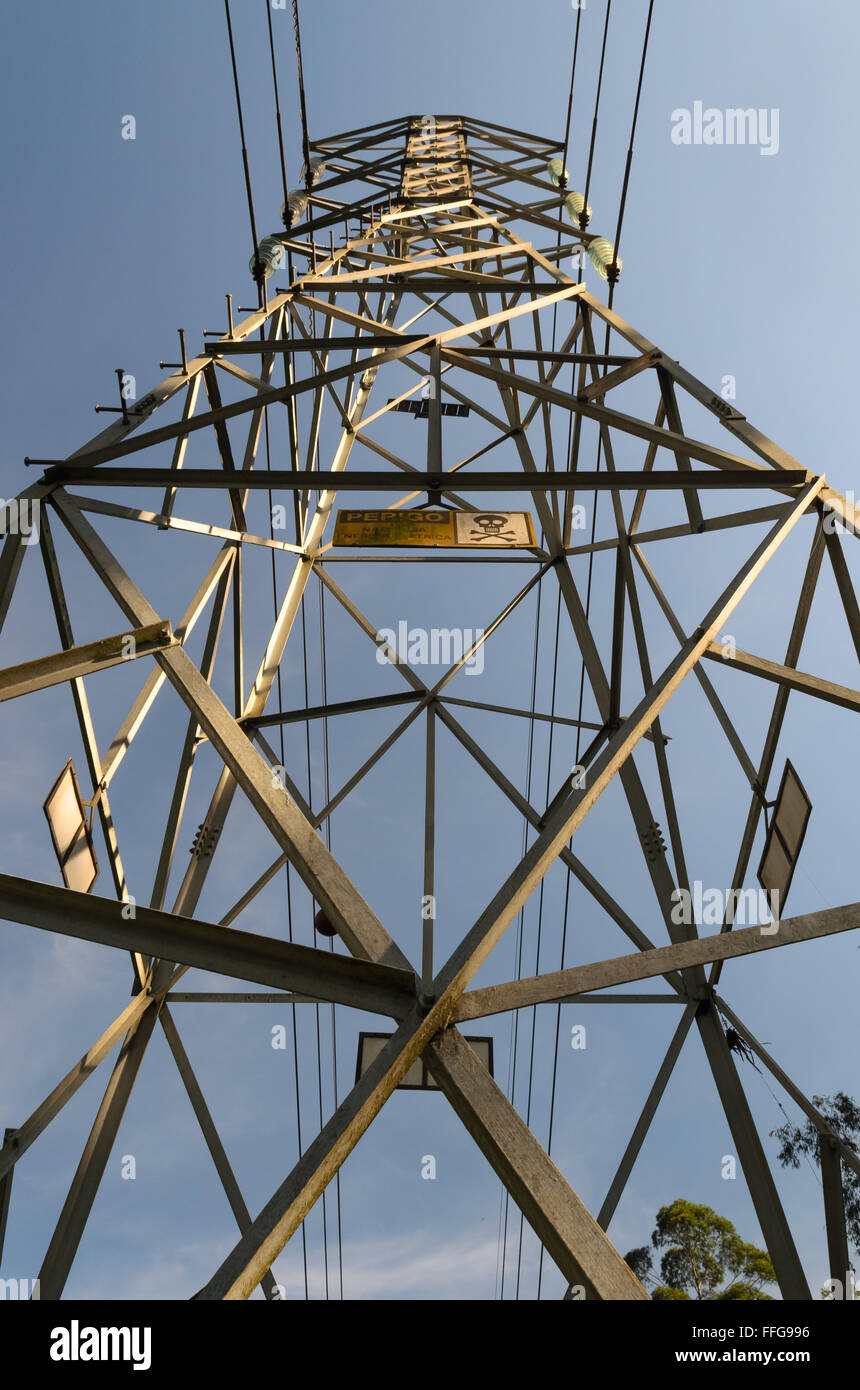 high voltage electricity tower under a blue sky Stock Photo - Alamy
