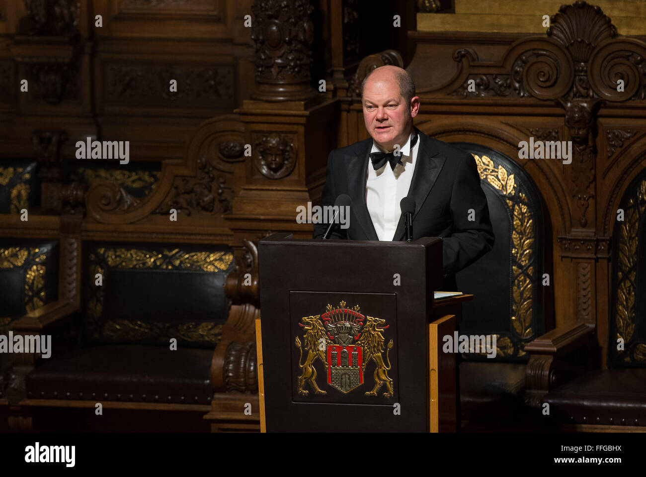 Hamburg, Germany. 12th Feb, 2016. Hamburg's governing mayor Olaf Scholz delivers a speech at the Matthiae dinner at the city hall of Hamburg, Germany, 12 February 2016. Britain's Prime Minister David Cameron and German Chancellor Angela Merkel are guests of honour at the oldest feast in the world. Since 1356, the leaders of the Hansa city invite distinguished guests to the Matthiae dinner. Photo: LUKAS SCHULZE/dpa/Alamy Live News Stock Photo