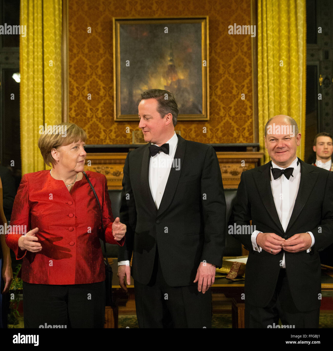 Hamburg, Germany. 12th Feb, 2016. German Chancellor Angela Merkel (L-R), Britain's Prime Minister David Cameron and Hamburg's First Mayor Olaf Scholz pose after signing the Golden Book prior to the annual Matthiae dinner at the city hall of Hamburg, Germany, 12 February 2016. Britain's Prime Minister David Cameron and German Chancellor Angela Merkel are guests of honour at the oldest feast in the world. Since 1356, the leaders of the Hansa city invite distinguished guests to the Matthiae dinner. Photo: CHRISTIAN CHARISIUS/dpa/Alamy Live News Stock Photo