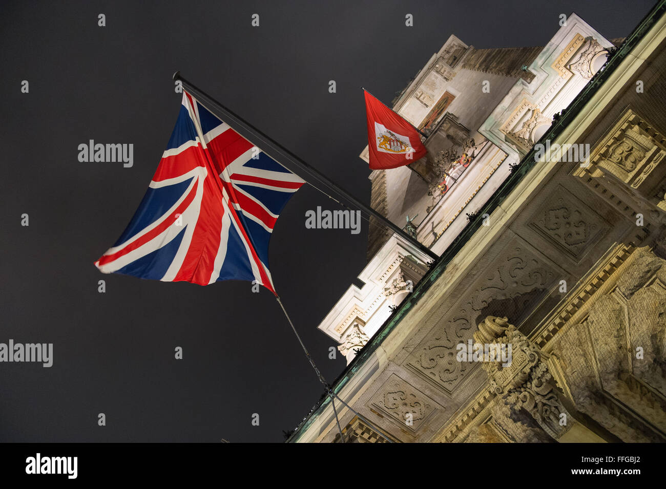 Hamburg, Germany. 12th Feb, 2016. A British flag and a flag featuring the emblem of Hamburg pictured at the Matthiae dinner at the city hall of Hamburg, Germany, 12 February 2016. Britain's Prime Minister David Cameron and German Chancellor Angela Merkel are guests of honour at the oldest feast in the world. Since 1356, the leaders of the Hansa city invite distinguished guests to the Matthiae dinner. Photo: LUKAS SCHULZE/dpa/Alamy Live News Stock Photo