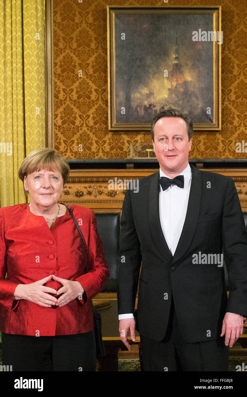 Hamburg, Germany. 12th Feb, 2016. German Chancellor Angela Merkel (L) and Britain's Prime Minister David Cameron pose after signing the Golden Book prior to the annual Matthiae dinner at the city hall of Hamburg, Germany, 12 February 2016. Britain's Prime Minister David Cameron and German Chancellor Angela Merkel are guests of honour at the oldest feast in the world. Since 1356, the leaders of the Hansa city invite distinguished guests to the Matthiae dinner. Photo: CHRISTIAN CHARISIUS/dpa/Alamy Live News Stock Photo