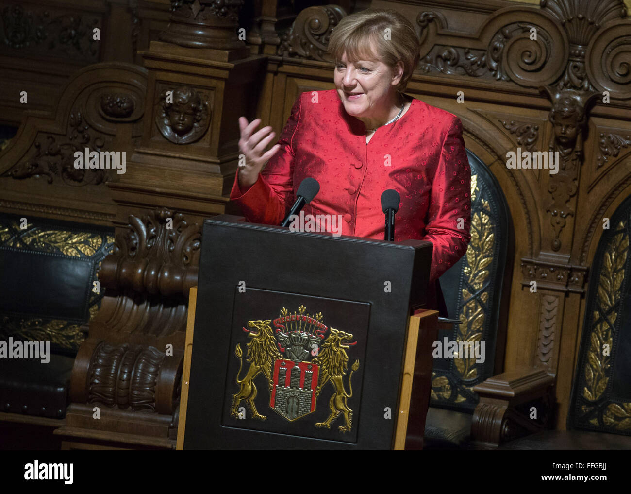 Hamburg, Germany. 12th Feb, 2016. German Chancellor Angela Merkel delivers a speech at the Matthiae dinner at the city hall of Hamburg, Germany, 12 February 2016. Britain's Prime Minister David Cameron and German Chancellor Angela Merkel are guests of honour at the oldest feast in the world. Since 1356, the leaders of the Hansa city invite distinguished guests to the Matthiae dinner. Photo: LUKAS SCHULZE/dpa/Alamy Live News Stock Photo