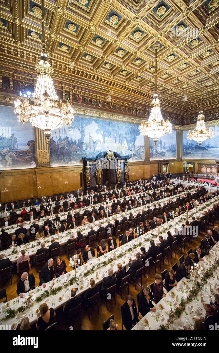 Hamburg, Germany. 12th Feb, 2016. Guests attend the annual Matthiae dinner at the city hall of Hamburg, Germany, 12 February 2016. Britain's Prime Minister David Cameron and German Chancellor Angela Merkel are guests of honour at the oldest feast in the world. Since 1356, the leaders of the Hansa city invite distinguished guests to the Matthiae dinner. Photo: LUKAS SCHULZE/dpa/Alamy Live News Stock Photo