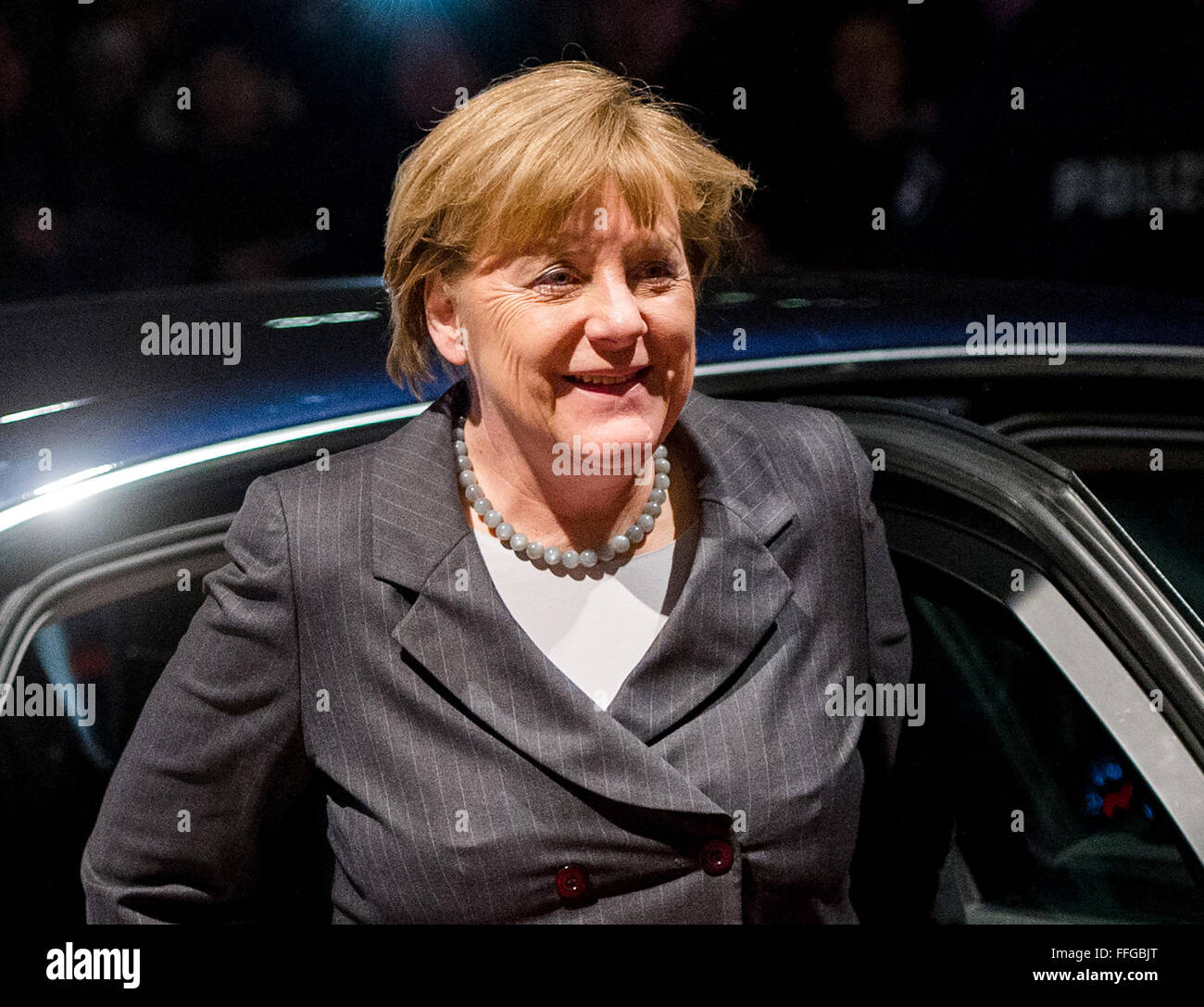 Hamburg, Germany. 12th Feb, 2016. German Chancellor Angela Merkel arrives to the annual Matthiae dinner at the city hall of Hamburg, Germany, 12 February 2016. Britain's Prime Minister David Cameron and German Chancellor Angela Merkel are guests of honour at the oldest feast in the world. Since 1356, the leaders of the Hansa city invite distinguished guests to the Matthiae dinner. Photo: DANIEL BOCKWOLDT/dpa/Alamy Live News Stock Photo