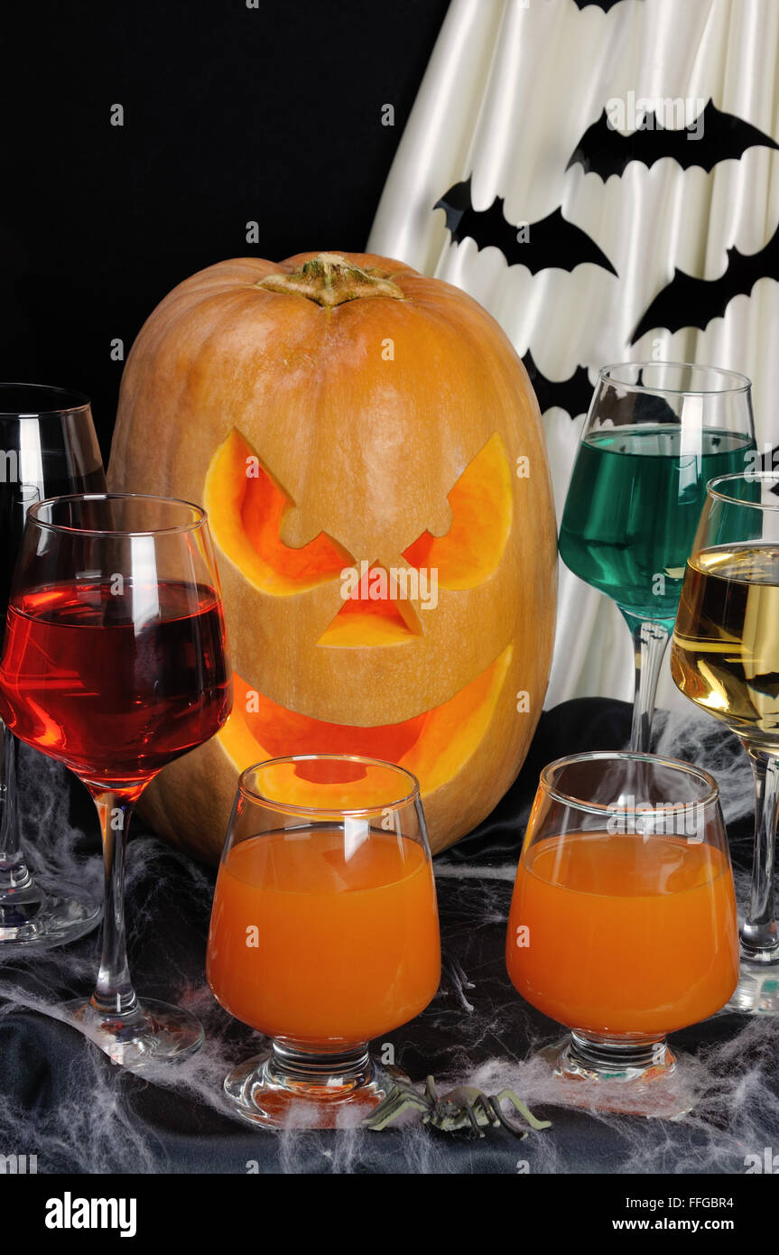 Glasses with different drinks on the table in honor of Halloween Stock Photo