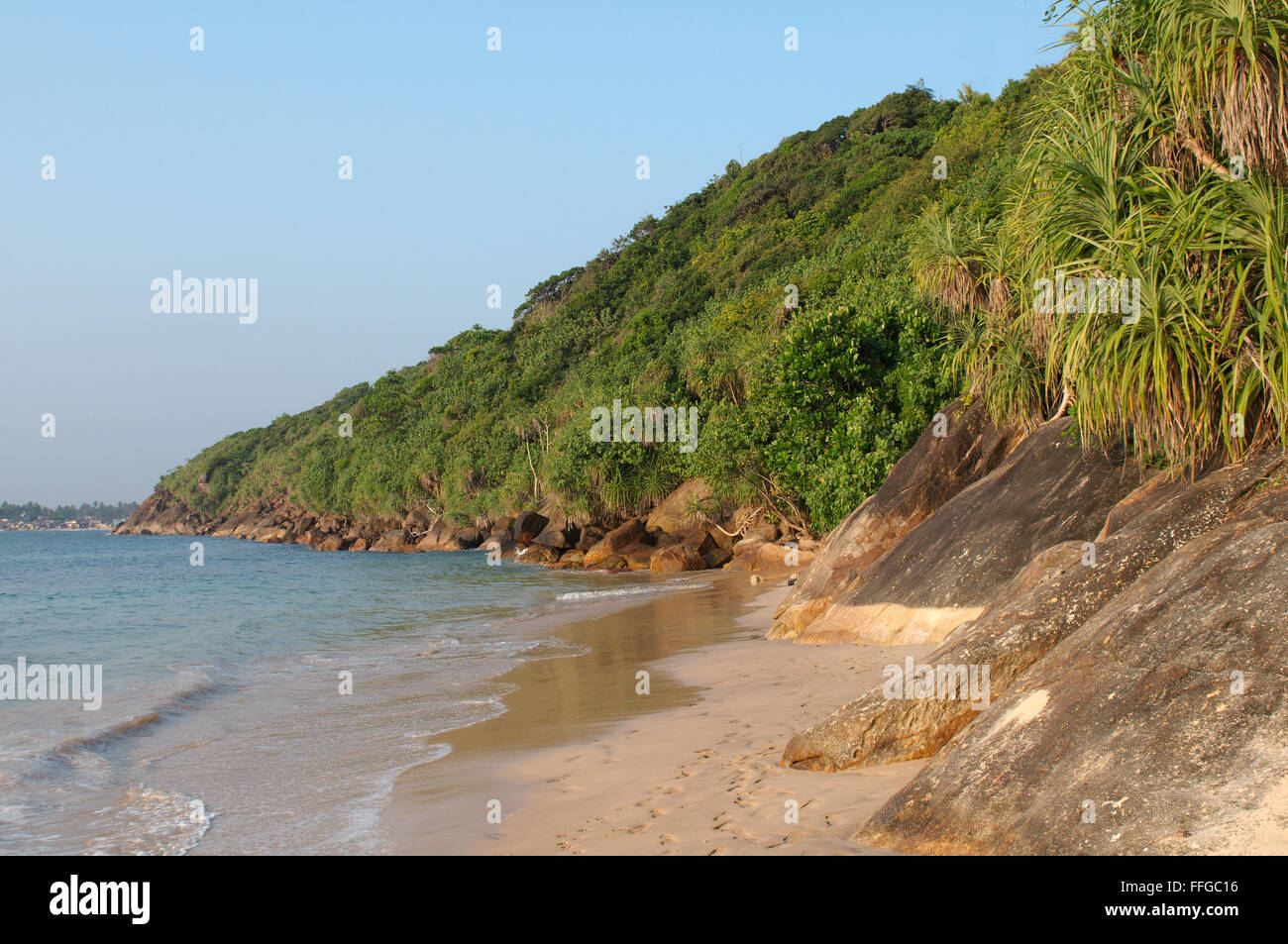 rocky shore on 'Jungle Beach', Hikkaduwa, Sri Lanka, South Asia Stock Photo