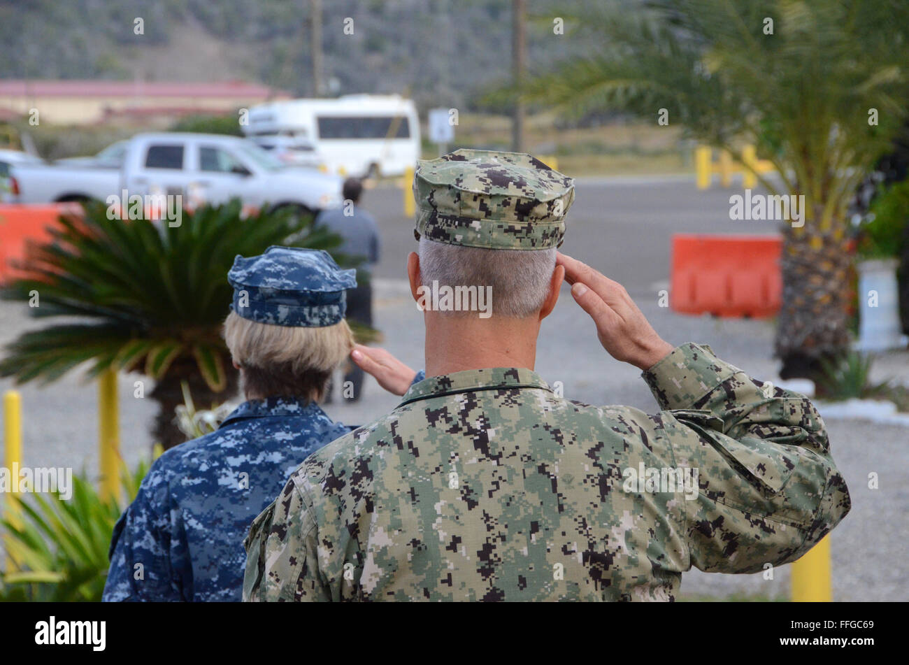 guantanamo bay cuba gtmo soldiers salute national anthem army and navy Stock Photo
