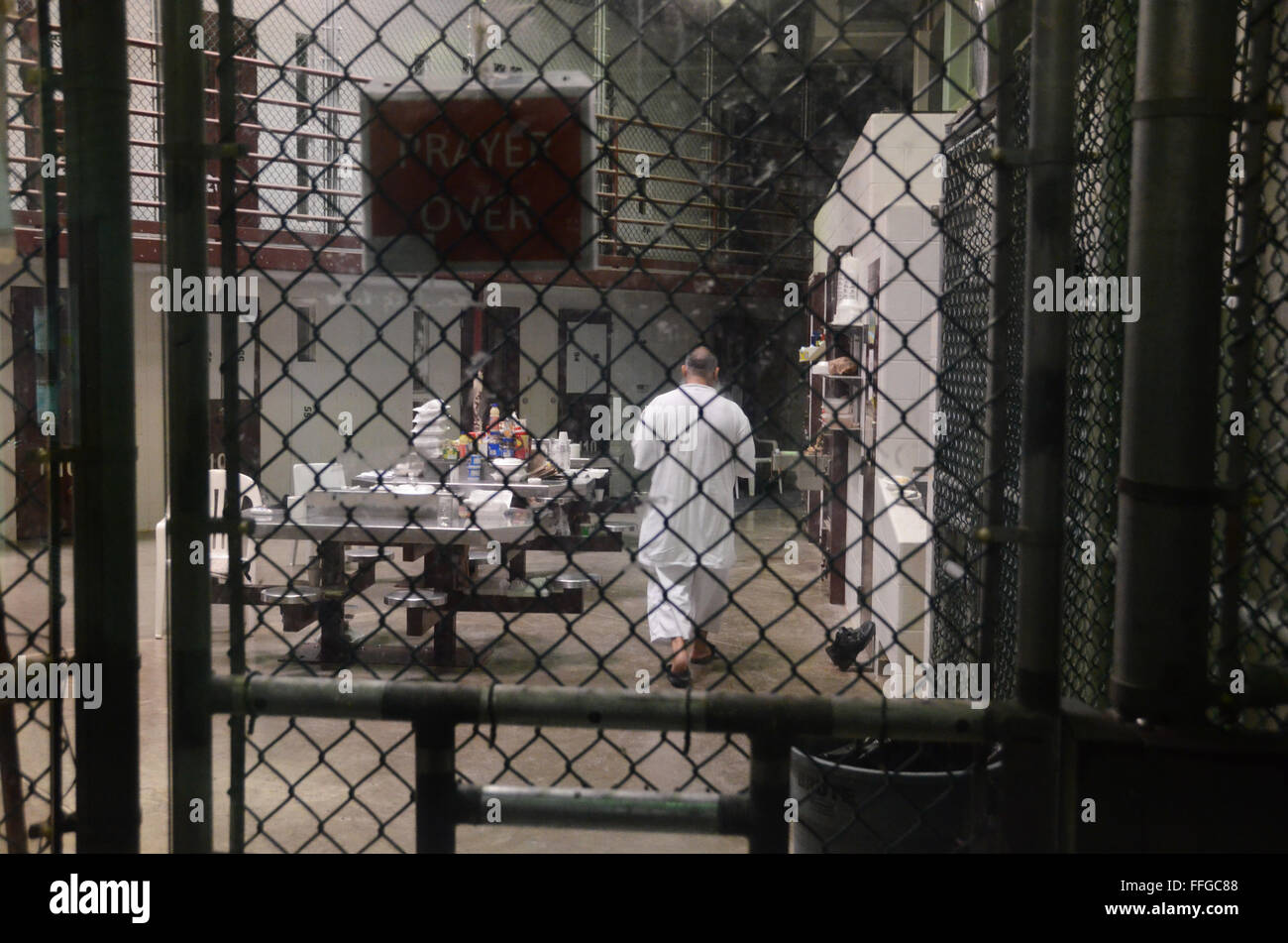 detainees guantanamo bay cuba camp six cell block muslim food prayer over sign wearing own clothes Stock Photo