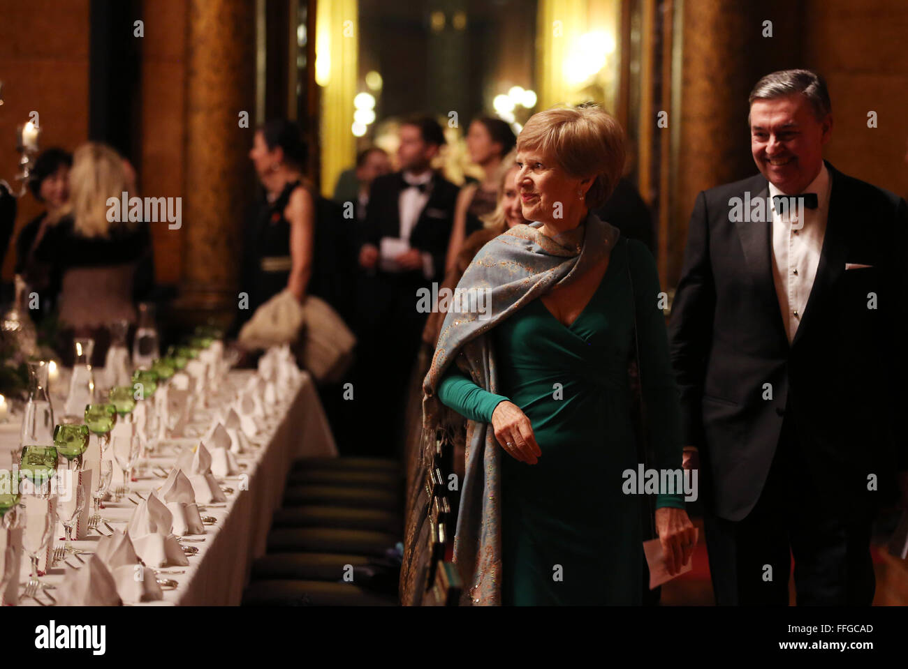 Hamburg, Germany. 12th Feb, 2016. Friede Springer (front L-R), German publisher and widow of Axel Springer, and Michael Behrendt, chairman of the board at Hapag-Lloyd, arrive to the Matthiae dinner at the city hall of Hamburg, Germany, 12 February 2016. Britain's Prime Minister David Cameron and German Chancellor Angela Merkel are guests of honour at the oldest feast in the world. Since 1356, the leaders of the Hansa city invite distinguished guests to the Matthiae dinner. Photo: CHRISTIAN CHARISIUS/dpa/Alamy Live News Stock Photo