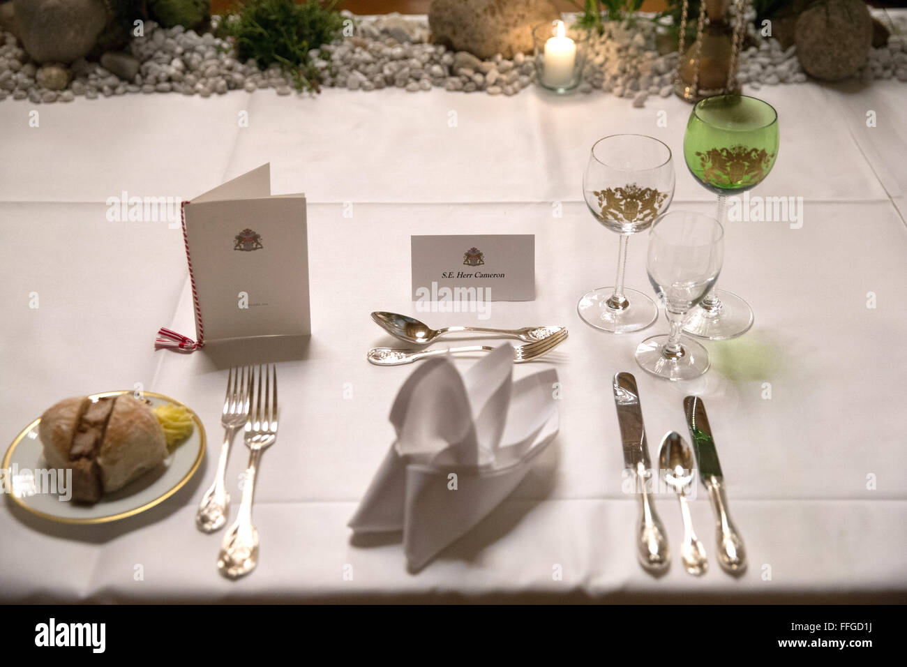 Hamburg, Germany. 12th Feb, 2016. The dinner setting for British Prime Minister David Cameron is seen prior to the annual Matthiae dinner at the city hall of Hamburg, Germany, 12 February 2016. Britain's Prime Minister David Cameron and German Chancellor Angela Merkel are guests of honour at the oldest feast in the world. Since 1356, the leaders of the Hansa city invite distinguished guests to the Matthiae dinner. Photo: CHRISTIAN CHARISIUS/dpa/Alamy Live News Stock Photo