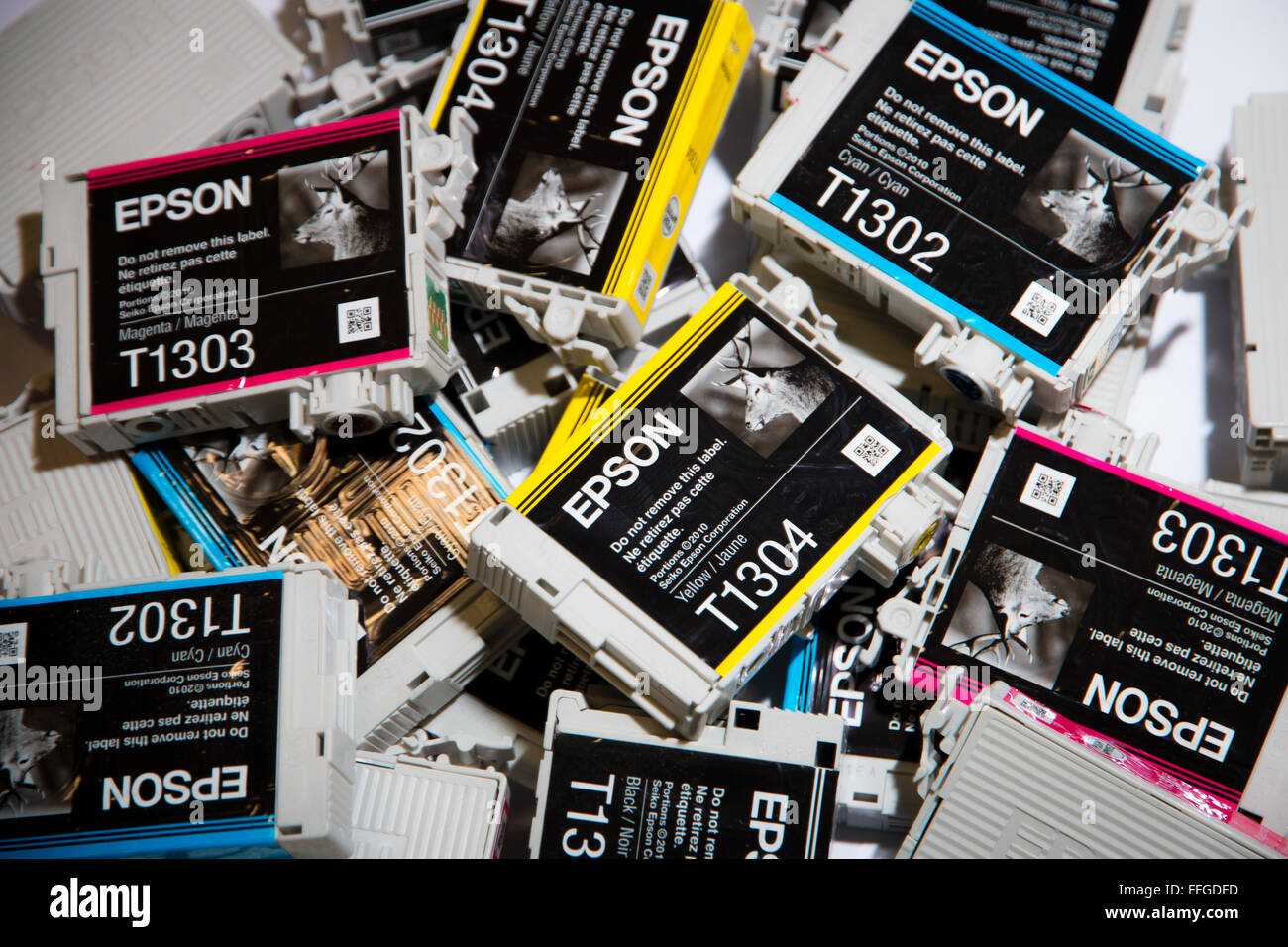 A mixed selection of Epson ink cartridges in Cyan, Magenta Yellow and Black. Stock Photo