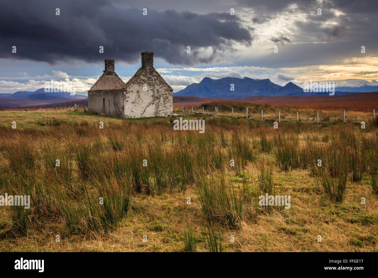 The abandoned building at Moine Ho, in Sutherland with Ben Loyal in the distance. Stock Photo
