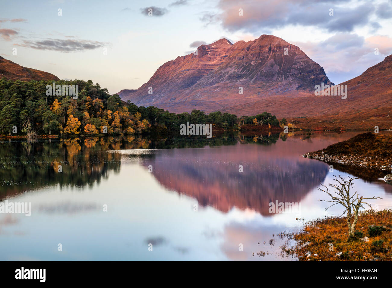 Laithach reflected in Loch Claire, in Glen Torridon, Scotland Stock Photo