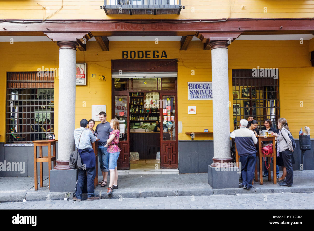People at Bar Bodega Las Columnas in Santa Cruz district, Seville, Andalusia, Spain Stock Photo