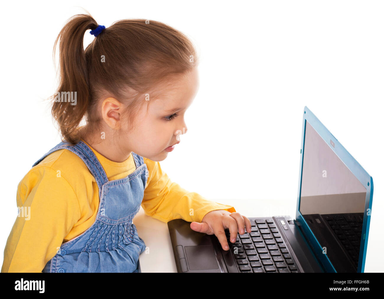 Little Girl Using Laptop - Isolated - Stock Image Stock Photo