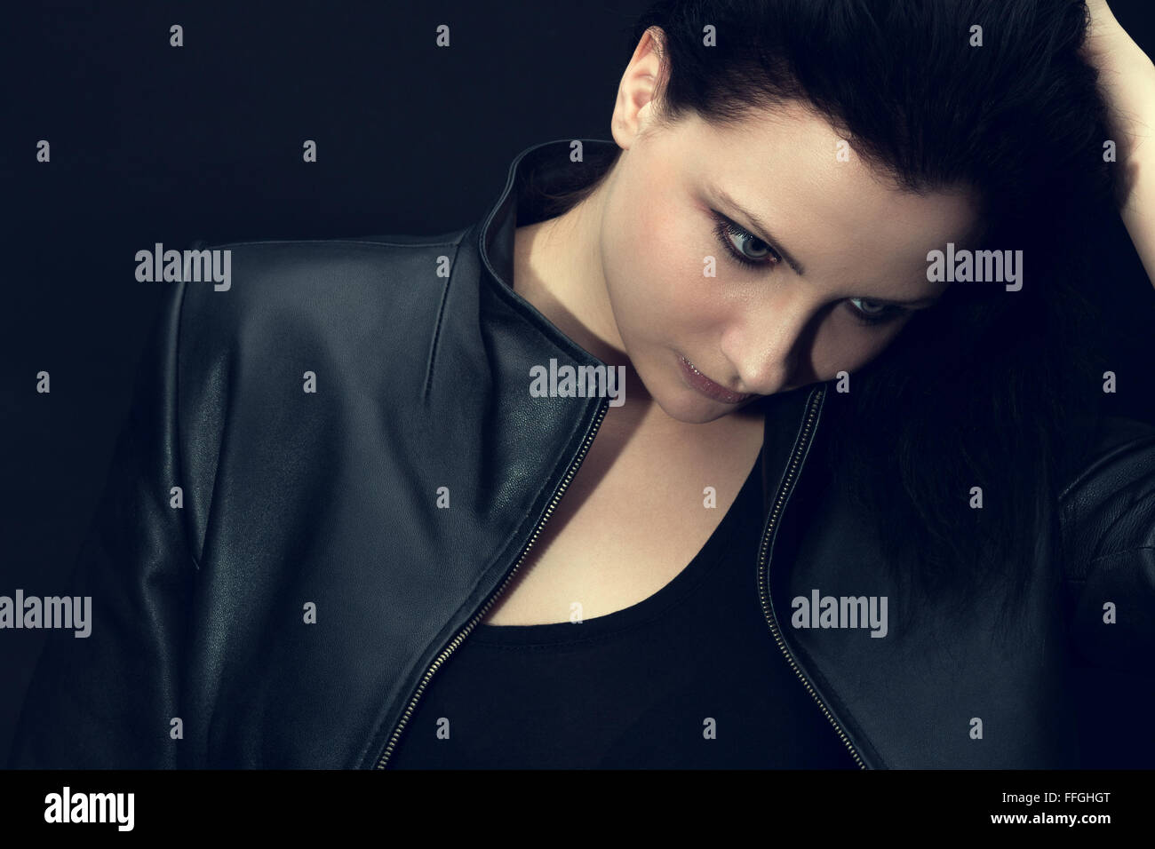 Portrait of beautiful sad woman on black background Stock Photo - Alamy