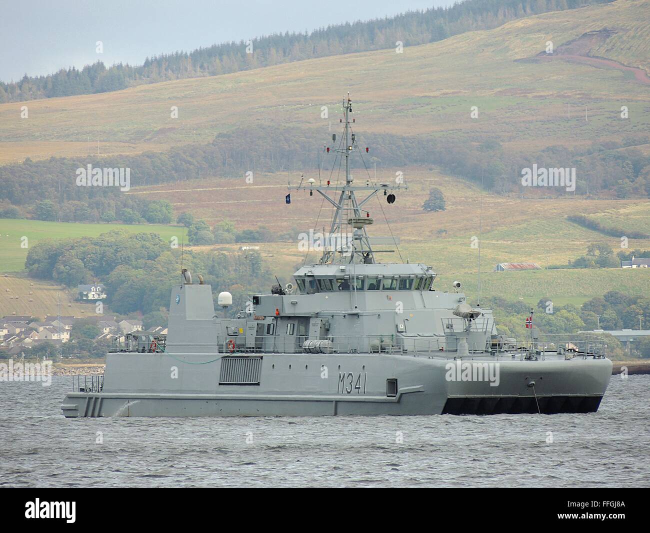 KNM Karmoy (M341), an Oksoy-class minehunter of the Norwegian Navy, sits of Greenock after arriving for Joint Warrior 12-2. Stock Photo