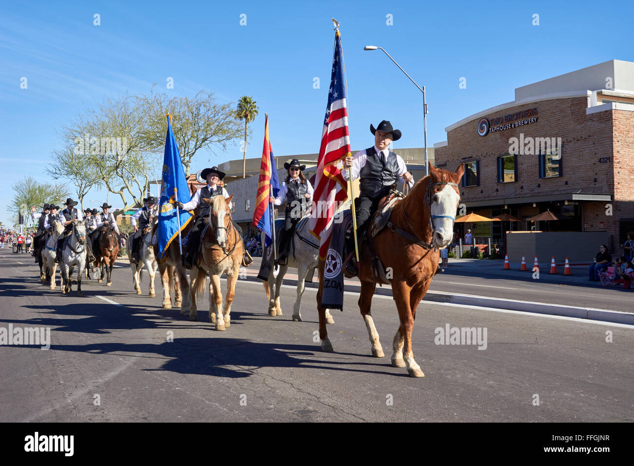 Scottsdale, Arizona, USA. 13th February, 2016. Horse riders carry