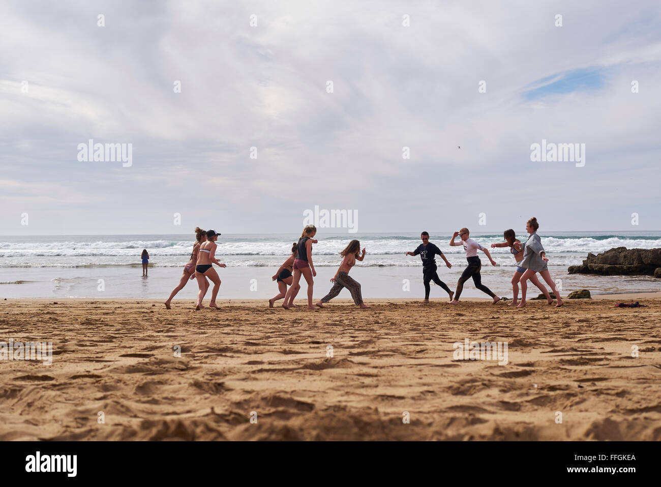 Dance group on the beach at Tamraght beach, Morocco, Africa Stock Photo