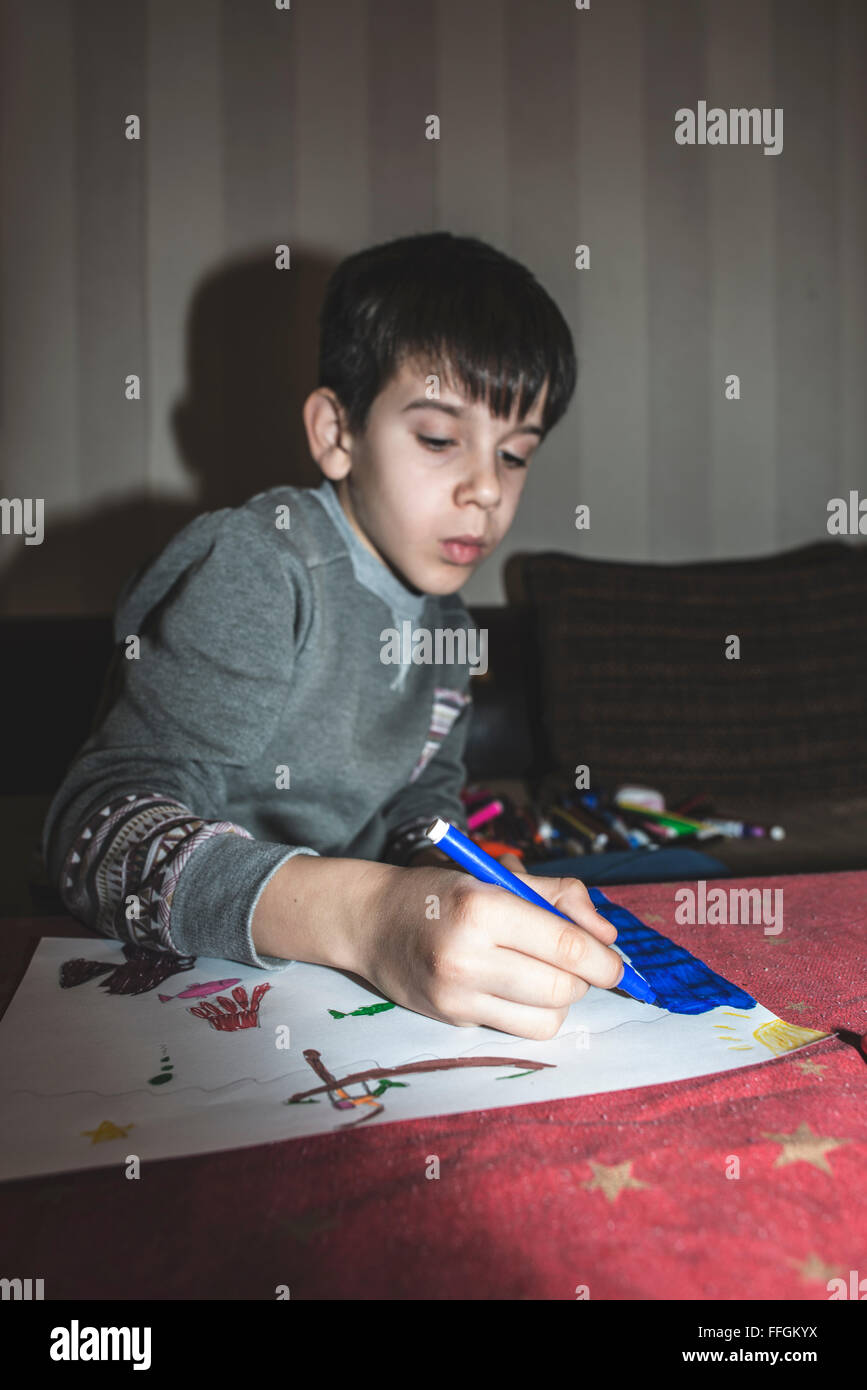 Child painting. Direct on camera flash Stock Photo Alamy