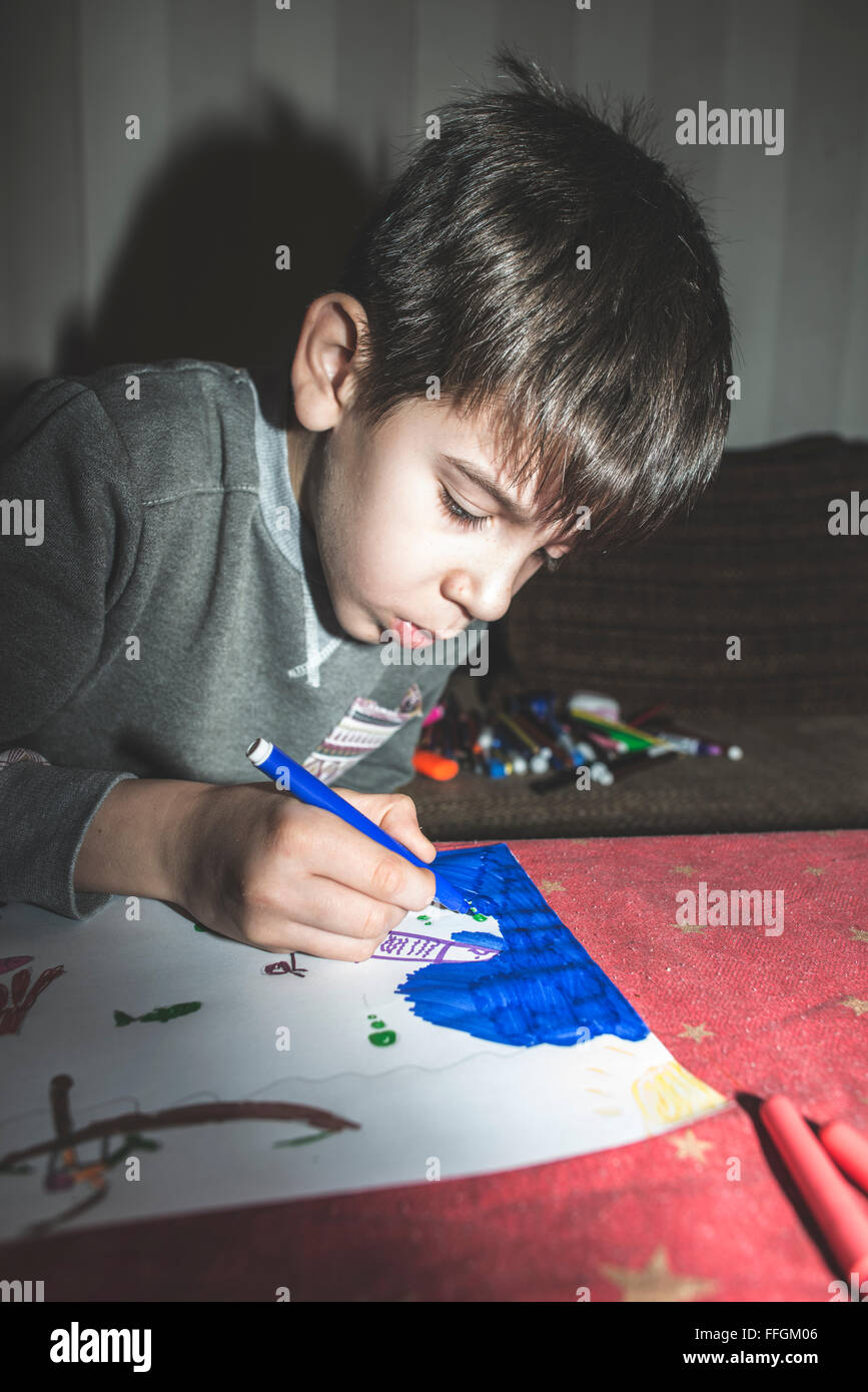 Child painting. Direct on camera flash Stock Photo - Alamy