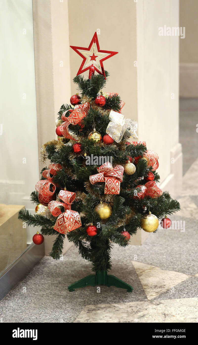 Beautiful green Christmas tree with toys photographed close up Stock Photo