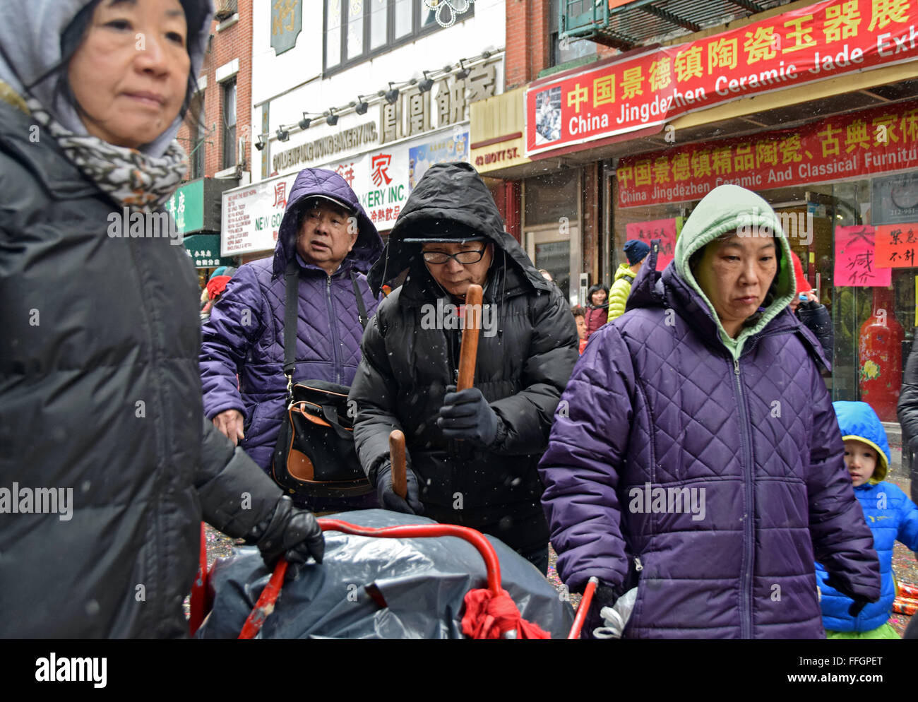 Four senior citizens play music in a parade for Chinese Lunar New Years 2016 on Mott St. in CHinatown, New York City Stock Photo