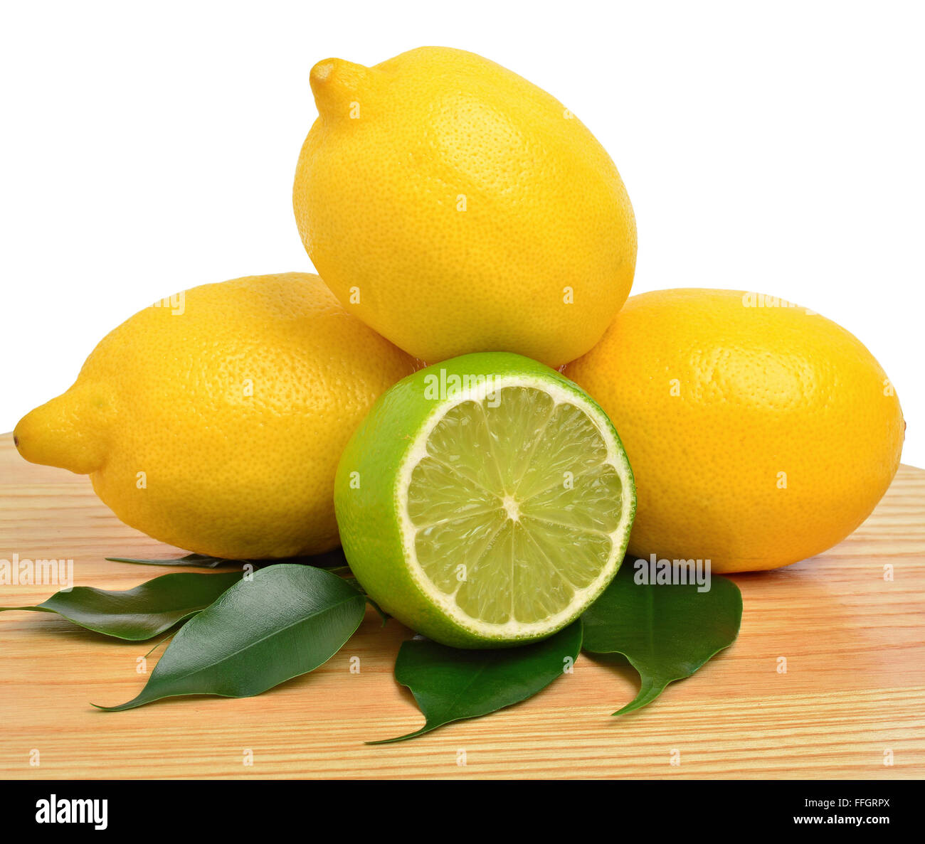 Cut lime and lemon with a green leaves isolated on white background