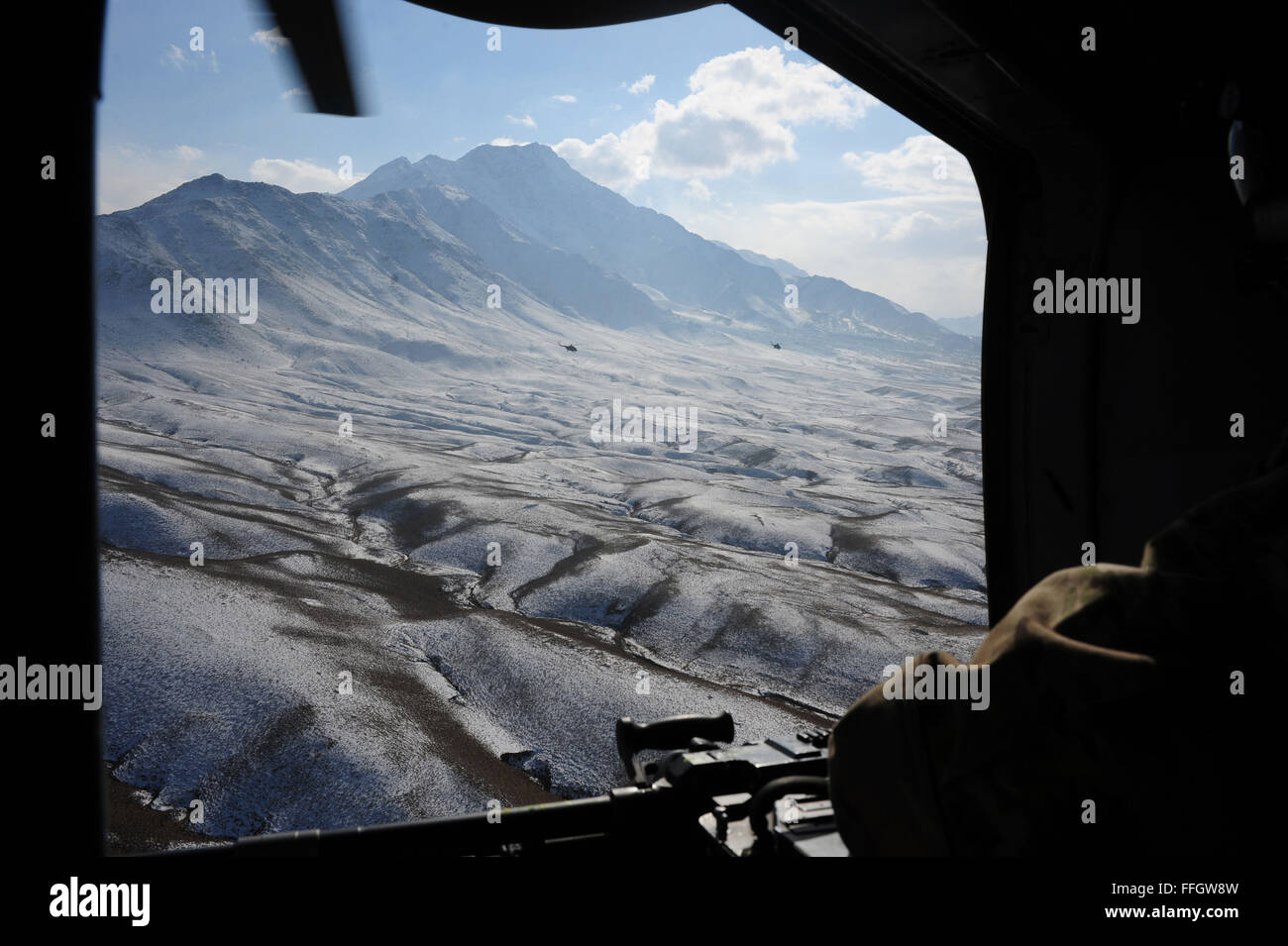 Afghan air force MI-17 helicopters fly in formation after completing a training mission in northeastern Afghanistan. The helicopters were flying from Jalalabad to Kabul International Airport. Stock Photo