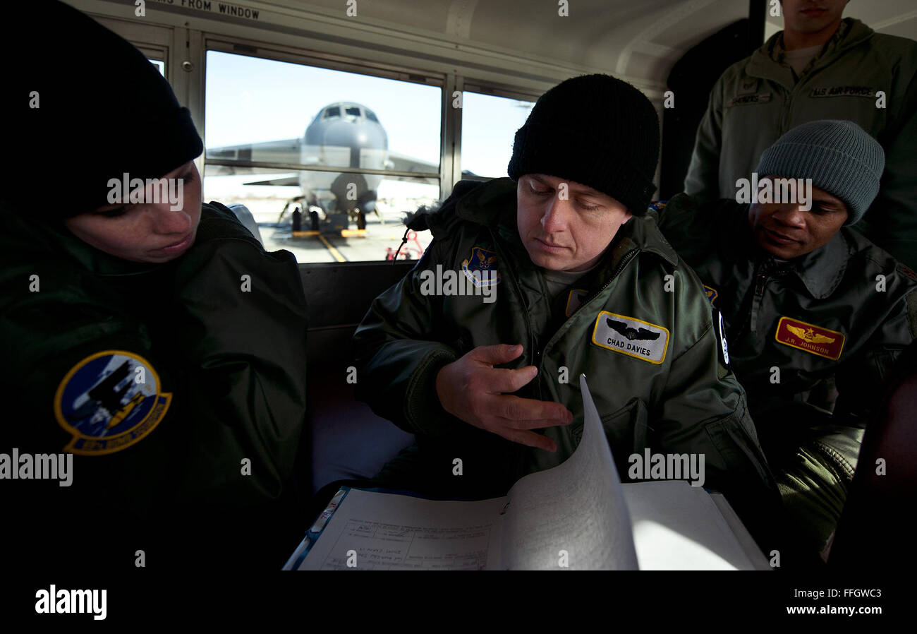 Capt. Chad Davies performs a crew brief aboard a warm passenger van on the Minot Air Force Base, N.D., flightline before stepping to B-52 Stratofortress Tail No. 1040. Stock Photo