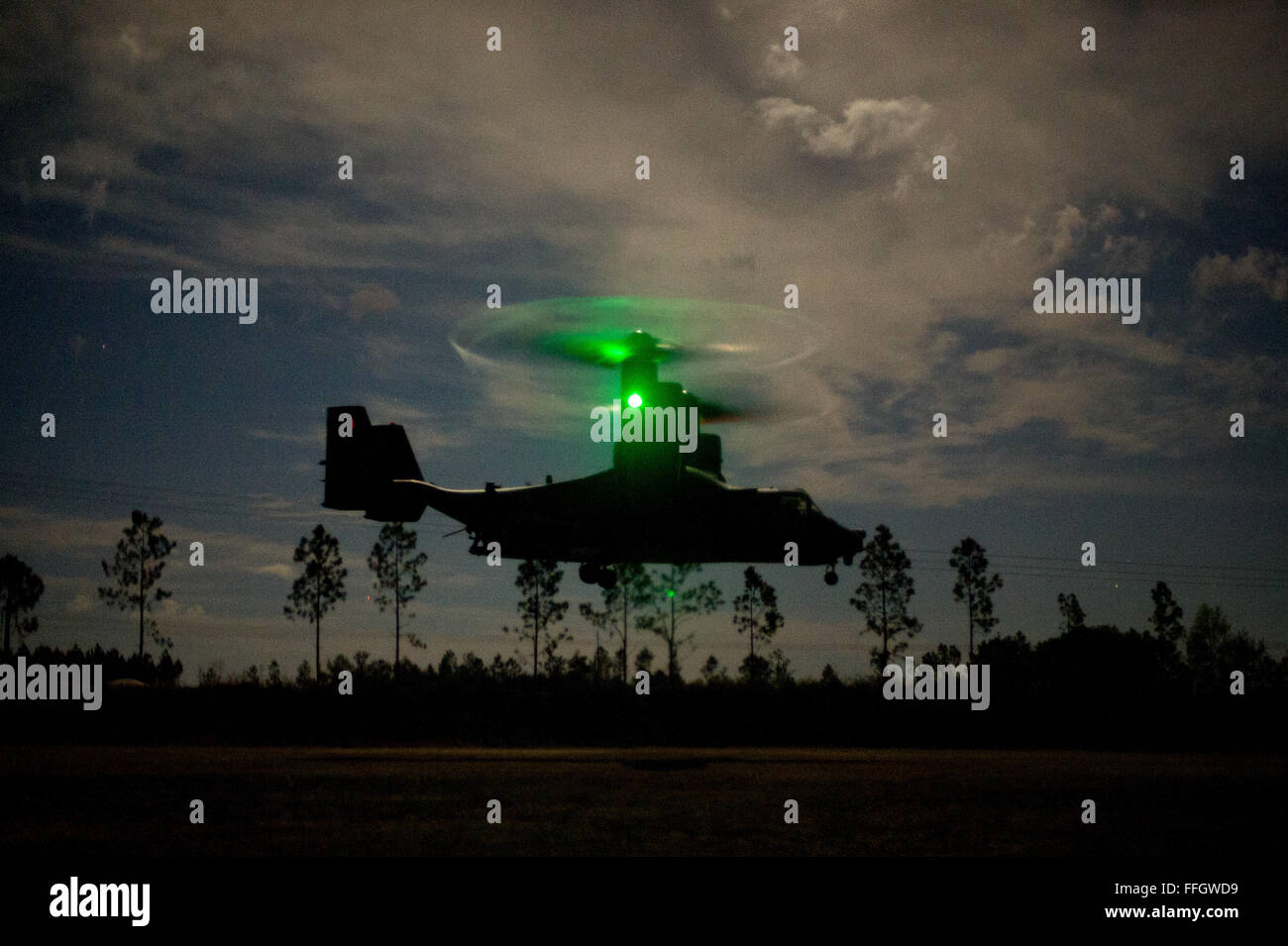 A U.S. Air Force CV-22 Osprey lands in a field during the Emerald Warrior exercise at Hurlburt Field, Fla. Stock Photo