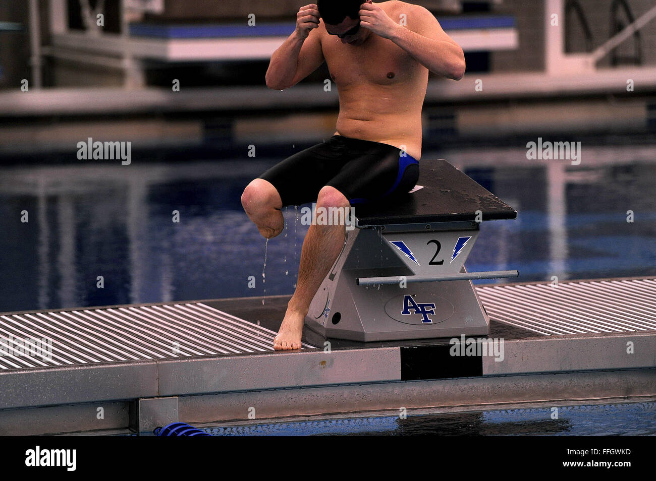 1st Lt. Ryan McGuire, a two-time participant in the Warrior Games, prepares himself for another swimming set from the starting blocks at the U.S. Air Force Academy pool during the Air Force selection camp for the 2012 Warrior Games. Stock Photo