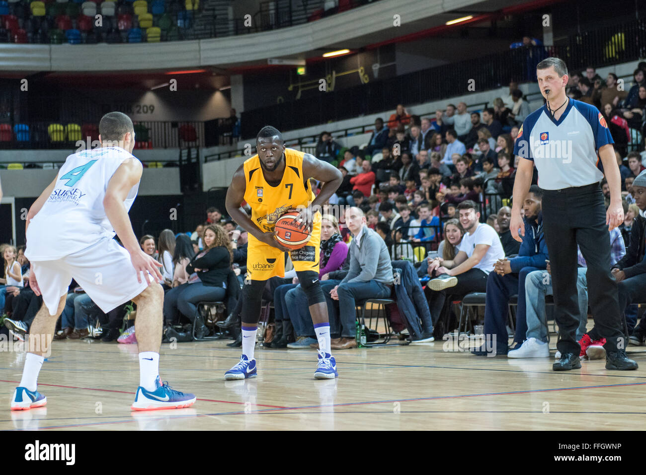 London, UK. 13th Feb, 2016. London Lions Captain Joe Ikhinmwin (07) looking for a space around Surrey Scorchers Jordon Williams (4) while the ref looks on. London Lions lost 82 vs 90 to Surrey Scorchers at the Copper Box, London Olympic Park. Credit:  pmgimaging/Alamy Live News Stock Photo