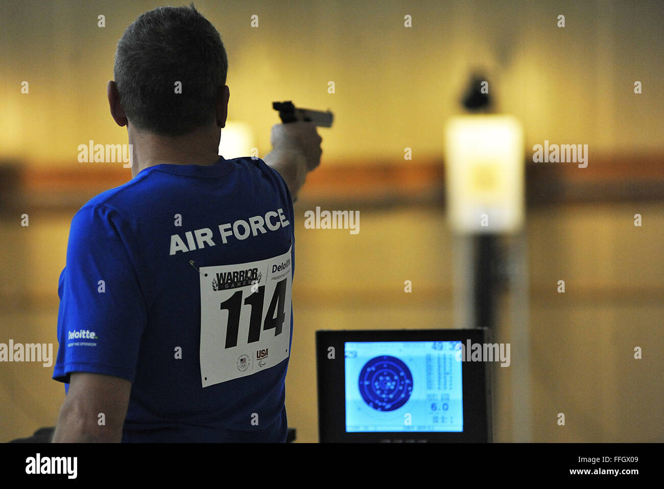 Maj. Greg Rich aims his pistol at his target during the shooting event Stock Photo