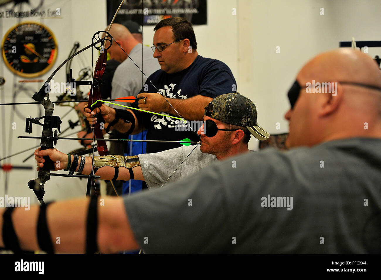 Air Force archery athletes practice shooting their arrows during the