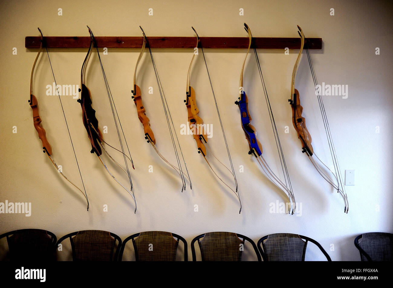 During the Air Force team's selection camp for Warrior Games, Air Force athletes' bows hang from the wall at the U.S. Air Force Academy archery range. Stock Photo