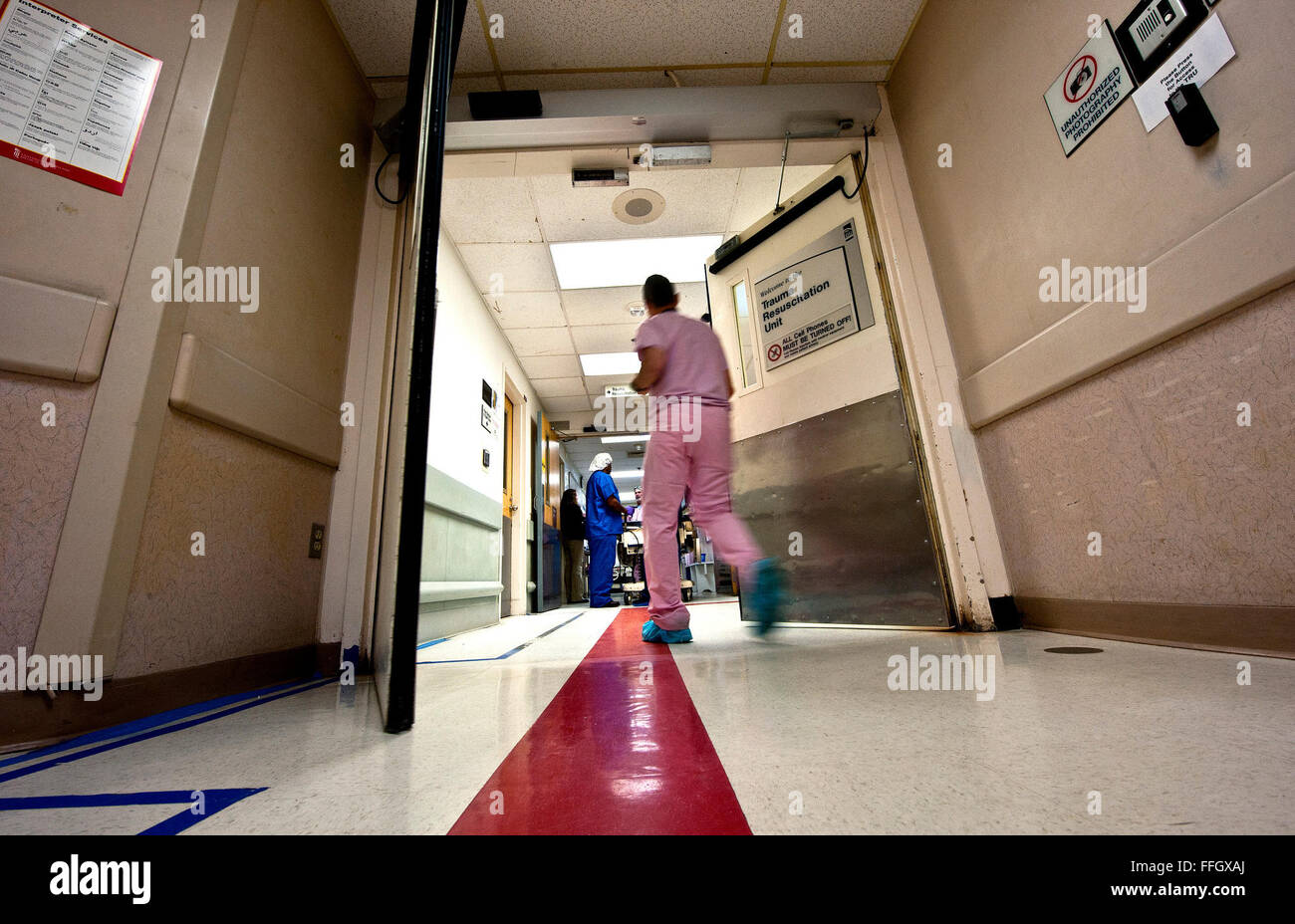 A CSTARS student rushes into the TRU after the transfer of two life-flighted patients of a motor vehicle accident.  Trauma patients are brought in by helicopter and transferred to the fourth floor of the shock trauma center. Stock Photo