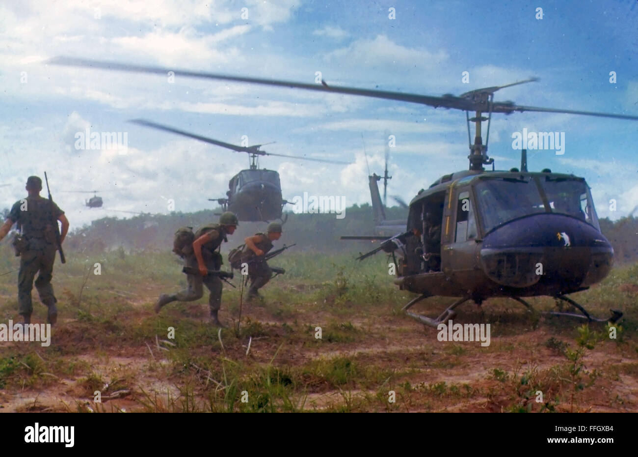 U.S. Army Bell UH-1D Iroquois, commonly known as Hueys, airlift members of the 2nd Battalion, 14th Infantry Regiment from the Filhol Rubber Plantation area to a new staging area during Operation Wahiawa, a search and destroy mission conducted by the 25th Infantry Division, northeast of Cu Chi, South Vietnam in 1966. Stock Photo