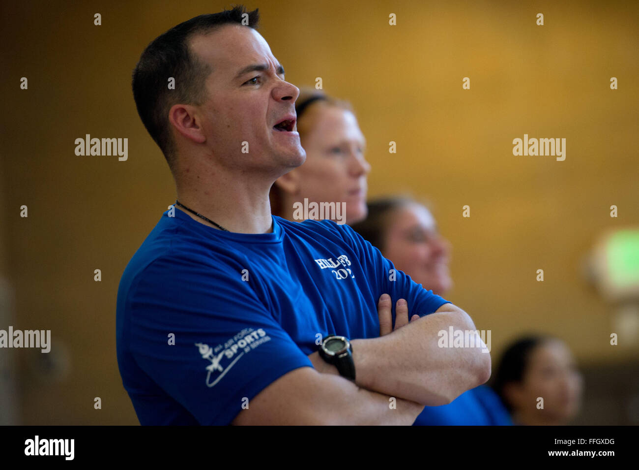 Senior Master Sgt. Jeffrey Barrows, assigned to the 124th Fighter Wing at Gowen Field, Idaho, yells out plays during a scrimmage against the Utah State University varsity volleyball team at Hill Air Force Base, Utah. Barrows is in his third year as the Air Force Women’s Volleyball team's head coach. Stock Photo