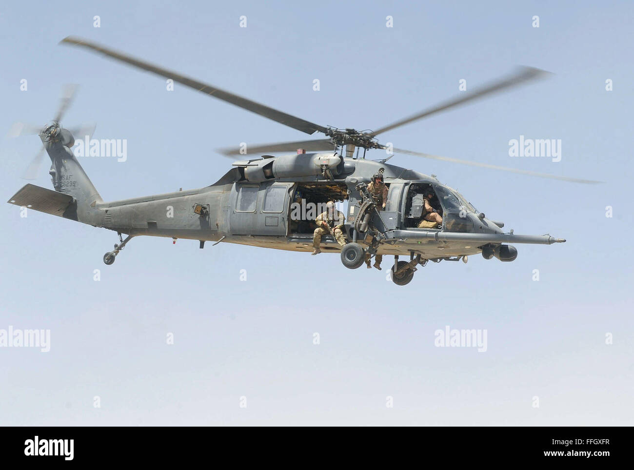 An HH-60G Pave Hawk helicopter crew takes off for an alert mission at Camp Bastion, Afghanistan. Members of the 46th Expeditionary Rescue Squadron recently began carrying blood again on rescue missions, increasing the survival rates for injured warfighters Stock Photo