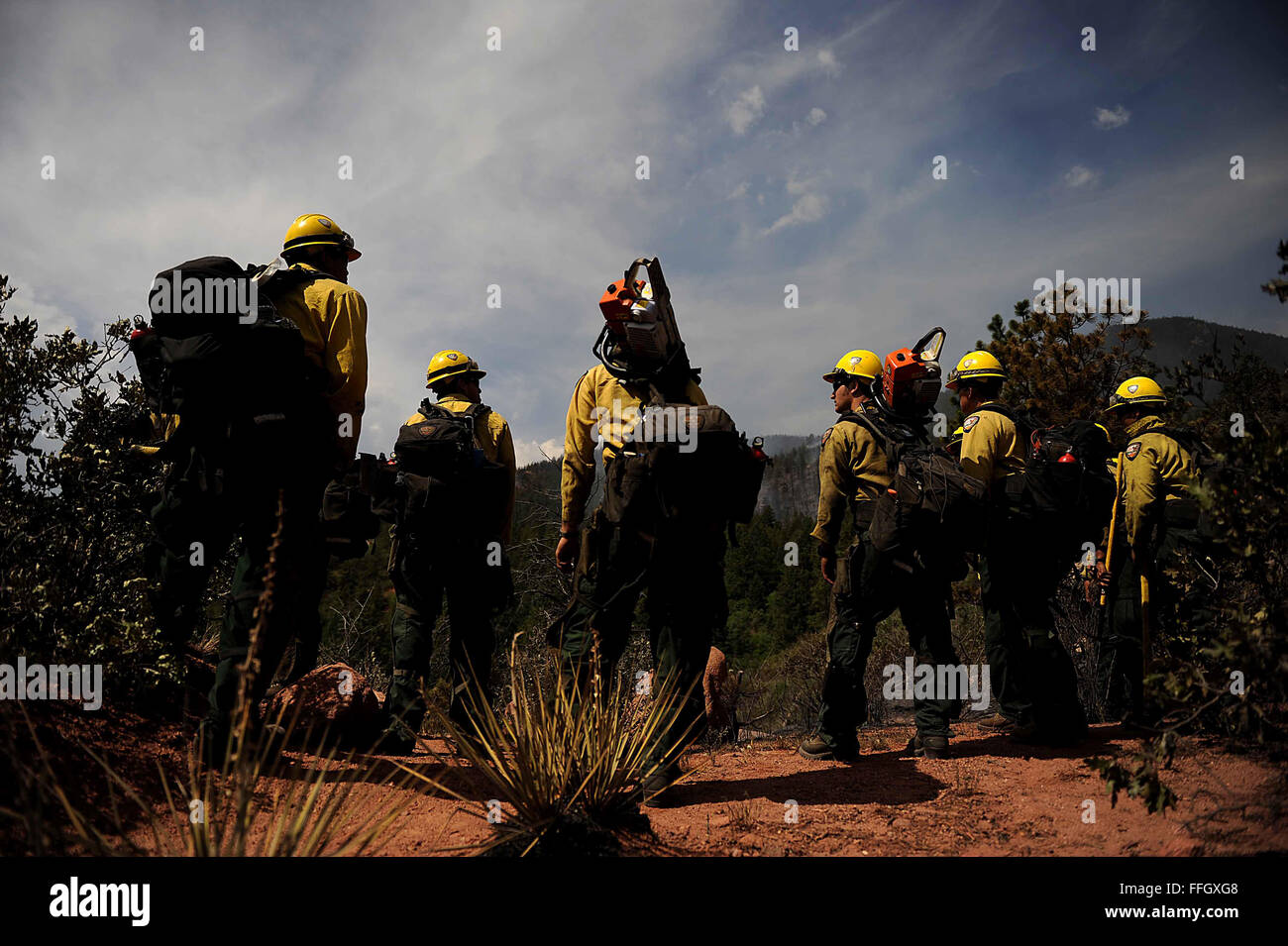 Vandenberg Air Force Base Hot Shot fire fighters prepare to cut a fire line on June 28, 2012 in the Mount Saint Francois area of Colorado Springs, Co. while helping to battle several fires in Waldo Canyon.  The Waldo Canyon fire has grown to 18,500 acres and burned over 300 homes. Currently, more than 90 firefighters from the Academy, along with assets from Air Force Space Command; F.E. Warren Air Force Base, Wyo.; Fort Carson, Colo.; and the local community continue to fight the Waldo Canyon fire Stock Photo