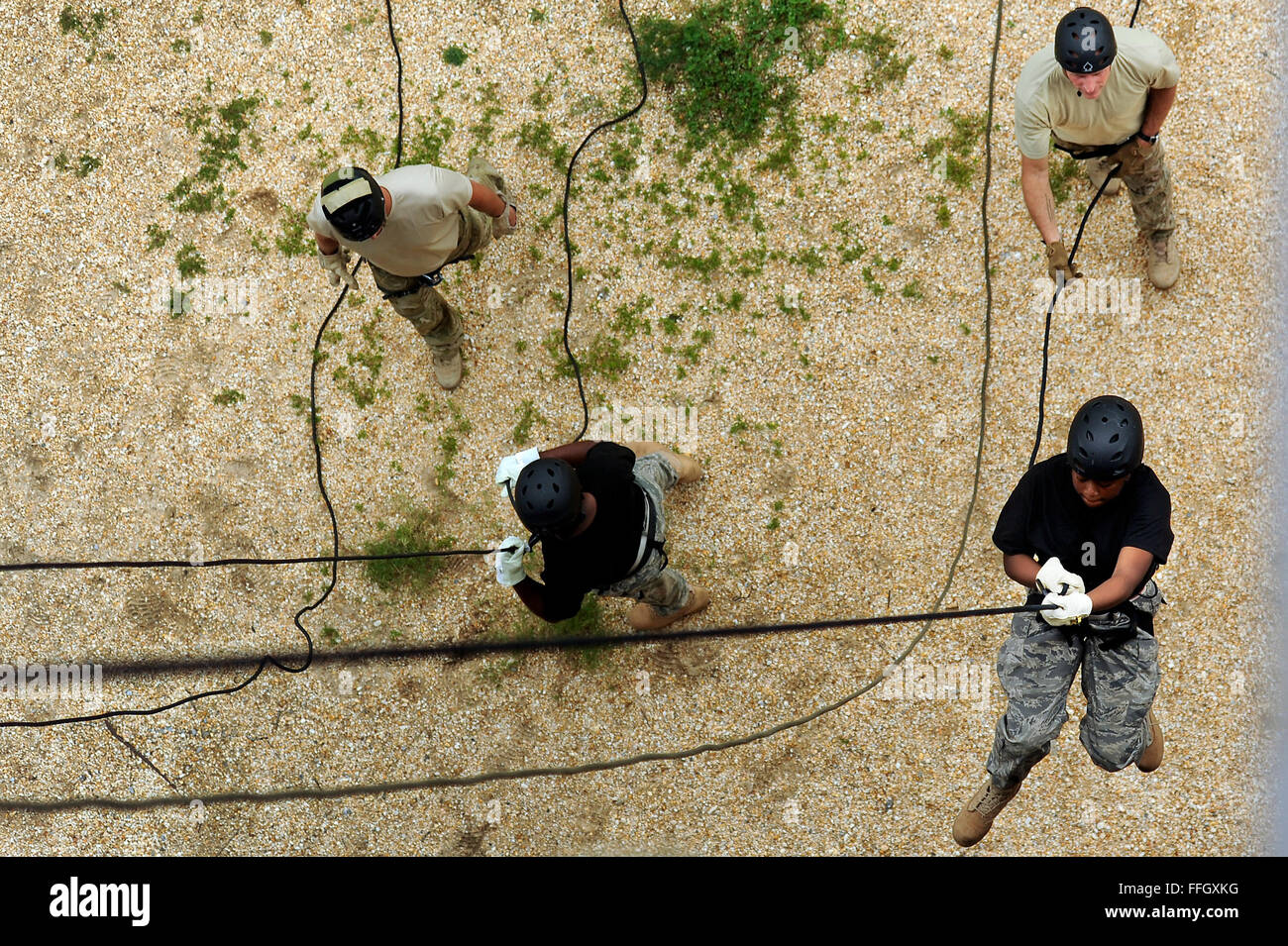 Air Force JROTC cadets successfully repel down a tower as part of a summer leadership school program. The program prepares cadets for leadership roles in their units, schools and communities. Stock Photo