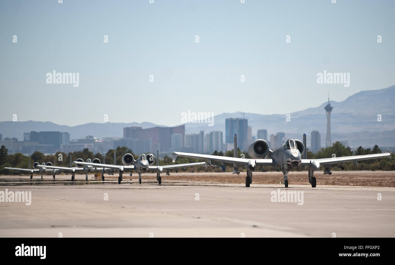 A-10C Thunderbolt IIs taxi down down the runway during Exercise Red Flag 12-4 at Nellis Air Force Base, Nev. The A-10s are assigned to Moody AFB, and the base's 23rd Wing is the lead wing for Red Flag this year and has more than 200 people deployed to Nellis AFB to support the air combat readiness exercise. Stock Photo