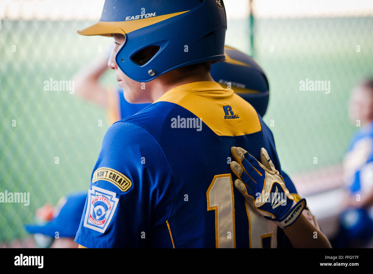 Europe player Nico Decosta gets a pat on the back from a teammate after their first loss during the 2012 LLWS. Stock Photo