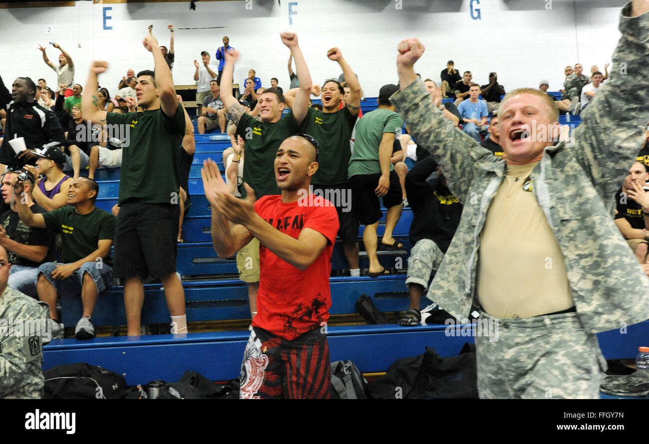 The audience cheers during the 2012 U.S. Army Combatives Championship competition. Stock Photo