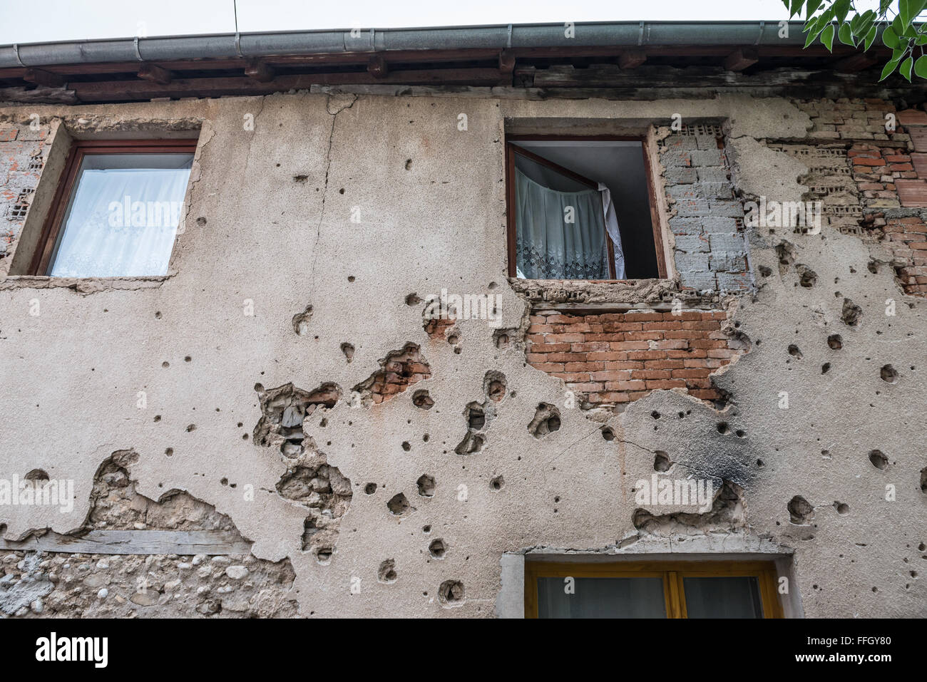 Bullet holes from Bosnian War period on the building in Mostar city, Bosnia and Herzegovina Stock Photo