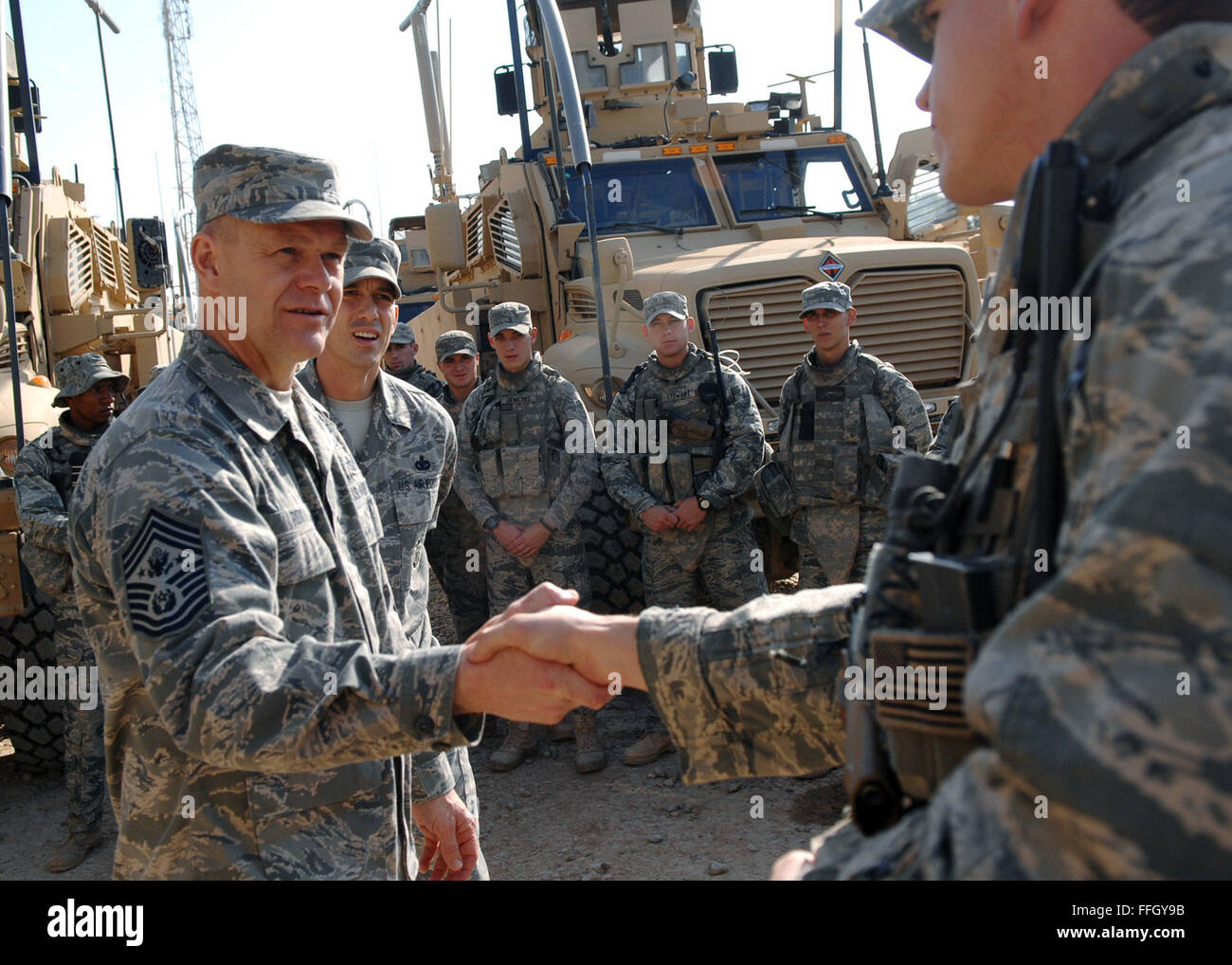 Chief Master Sgt. of the Air Force James A. Roy shakes hands with security forces Airmen at Joint Base Balad,  Iraq. During his first visit to JB Balad as the chief master sergeant of the Air Force, Roy discussed issues Airmen have encountered in their career fields and deployments. Stock Photo