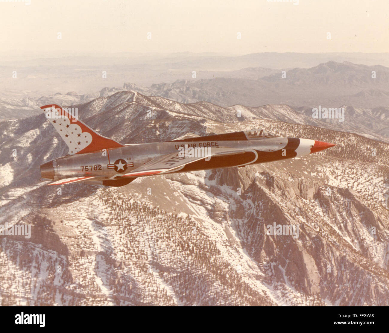 A Thunderbird F-105B “Thunderchief” in flight in 1964. The team switched to the F-105B for a brief period in 1964, after only performing six airshows in it. Instead of performing the extensive modifications to the F-105s transitioned to the F-100D 'Super Saber.' Stock Photo