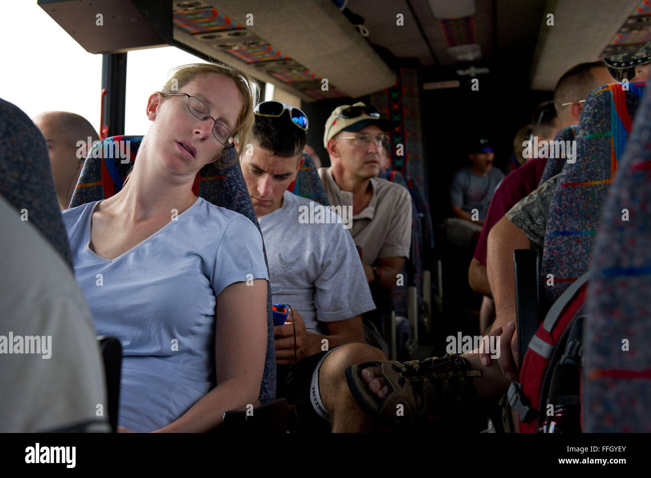 Kendra Johnson sleeps on the three-hour bus ride from Offutt Air Force Base, Neb., to Sioux Center, Iowa, where the Register’s Annual Great Bicycle Ride Across Iowa begins. The RAGBRAI Air Force Cycle Team faced seven days of extreme heat, humidity, long rides, and camping in city parks and abandoned lots. Johnson is a military spouse and support crew member. Stock Photo