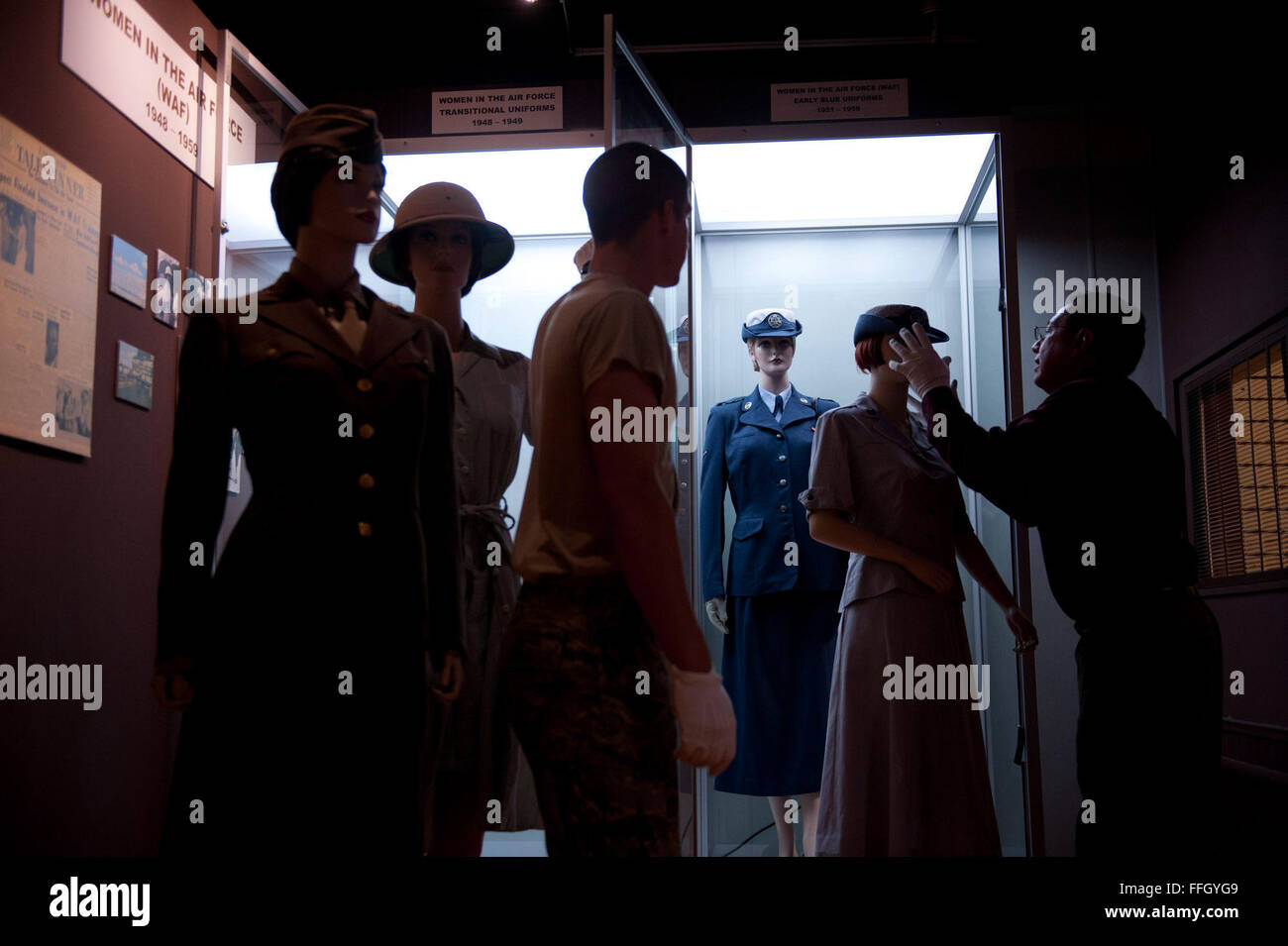 Fernando Cortez carefully prepares the Women in the Air Force uniform exhibit to be cleaned. Cortez is the curator of the USAF Airman Heritage Museum at Joint Base San Antonio-Lackland, Texas. Stock Photo